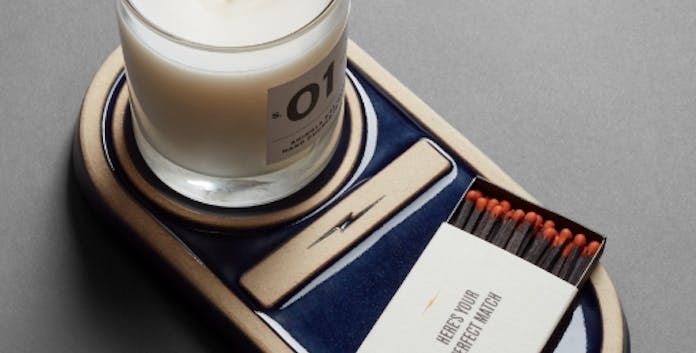 Shinola X Pewabic candle tray with Shinola candle and matches resting on it